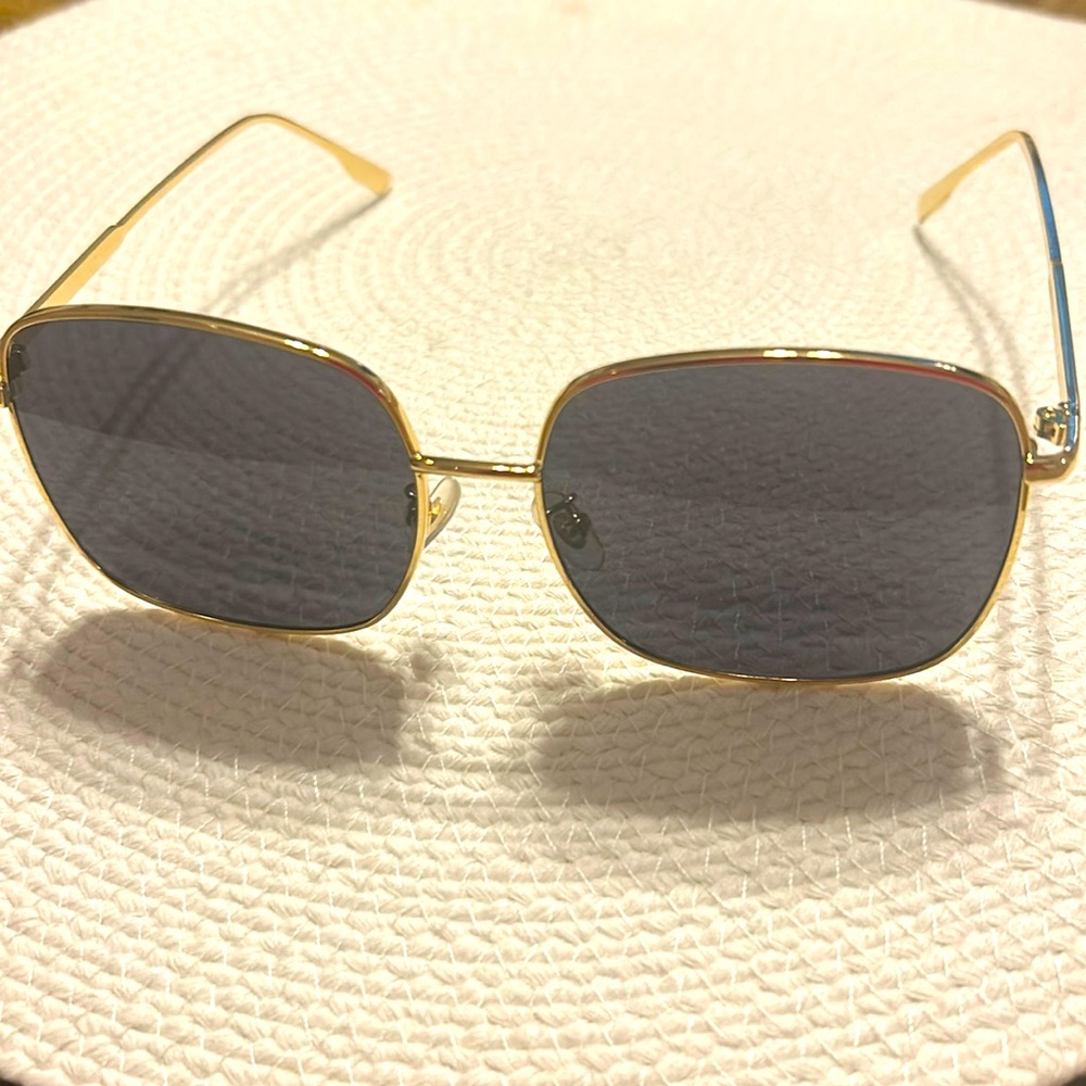 Gold rimmed black lens sunglasses